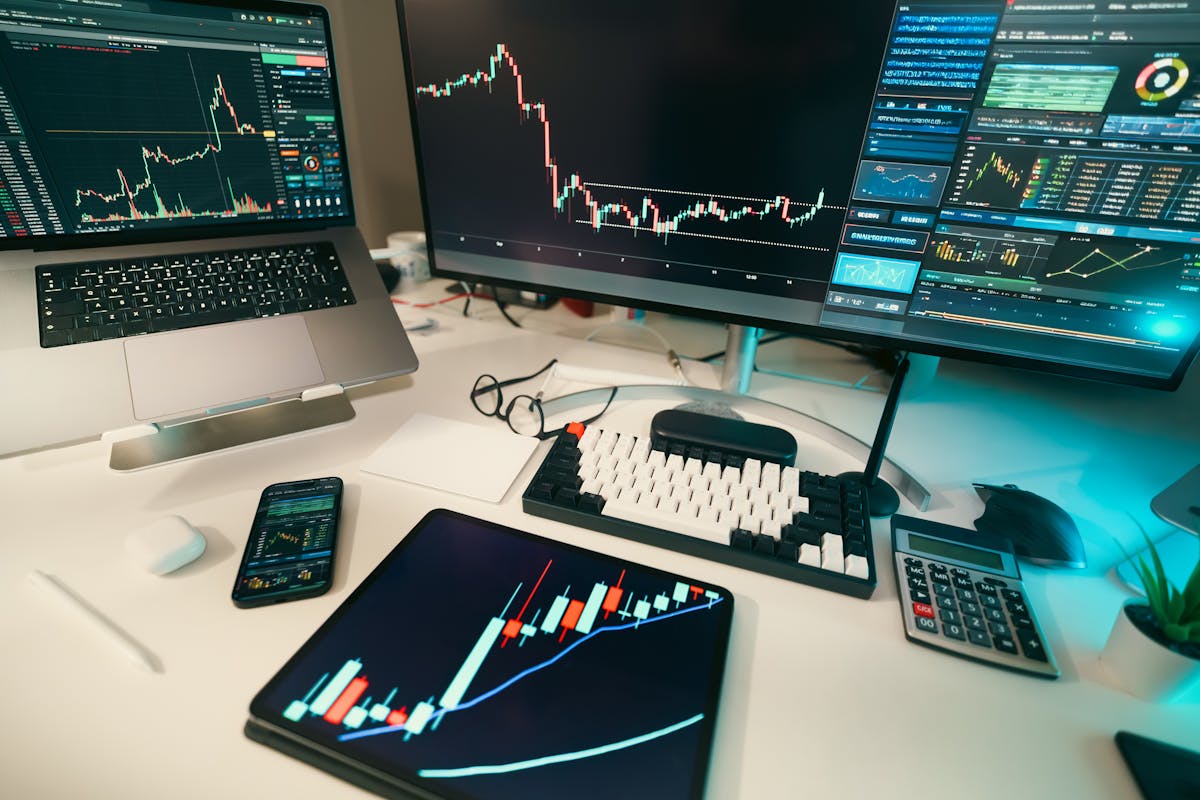 Trading desk with multi-screen market charts